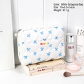 White quilted makeup bag with blue bow prints and pearl zipper pull, size 19x6.5x14cm - White Octagonal Style