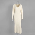 Detail view of the cream V-neck knit midi dress featuring a slim ribbed texture - S / Apricot