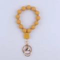 Detailed top view of a yellow silicone beaded keychain with crystal metal spacers - Turmeric
