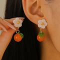 Sweet orange fruit earrings with white flower and green leaf dangles for women - KC Gold Orange