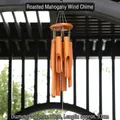 Bamboo wind chime in reddish-brown finish hanging in a garden pavilion - Baked Redwood Sheet (Dia 10cm/Len 33cm)