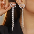 Sparkling silver heart tassel earrings with rhinestones for a luxury look on model - Silver Heart Five-Row Tassel Style (DTE1816404S-W)