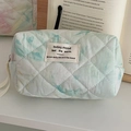Close-up of quilted tie-dye cosmetic bag featuring blue-green patterns and zipper detail - Watercolor Smudge [Octagonal Bag]