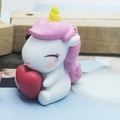 Cute white unicorn cake topper with pink mane and red heart for birthday decoration - Pink Holding Heart