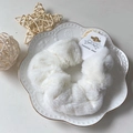Soft white faux rabbit fur scrunchie hair tie on a white ceramic display plate - White