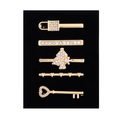 Close-up of a 5-piece gold hair clip set featuring locks, stars, and diamond charms - D3028 Double Key/Christmas Tree Set 18