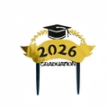 Macro shot of 2026 Graduation cake topper in gold and black metallic finish for party - Black Base Wheat Ears 2026