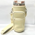 Beige 40oz tumbler carrier with adjustable shoulder strap and zipper pocket - Large Cup Sleeve With Pocket Beige