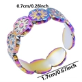 Macro detail of rainbow stainless steel floral ring showing 0.7cm width dimensions - Rainbow