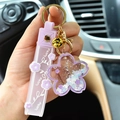 Purple cherry blossom quicksand keychain with acrylic flower charm and lucky strap - Purple