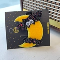 Detail of Halloween hair clip with sequin black bat and glittery yellow moon on card - Moon Bat