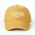 Detailed close-up of yellow washed cotton baseball cap with white CALIFORNIA embroidery - Adjustable / Yellow