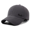 Gorra de béisbol de pana gris oscuro con parche de cuero NLS sobre un fondo blanco limpio - gris oscuro