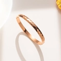 Elegant 18k rose gold plated titanium steel bangle with geometric rhombic facets for women - Diamond-Cut Rose Gold