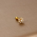 Detailed macro view of gold flower cartilage stud with 13 clear cubic zirconia crystals - Full Zirconia Flower / Gold