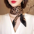 Classic leopard print satin square scarf in khaki and black, tied elegantly on neck - Leopard-spot Square Scarf / 65