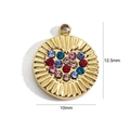 Macro detail of a 12.5mm gold stainless steel heart pendant with colorful crystals - Heart