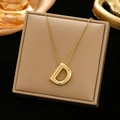 Gold stainless steel necklace featuring a chunky 3D letter D pendant on a jewelry box - Gold-D