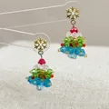 Close-up of handmade beaded Christmas tree earrings with gold snowflake studs and colorful crystals - Snowflake Christmas-Pair / Stud Earrings