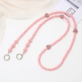 Pink plush beaded phone lanyard with heart charm and metal buckles on white background - Pink