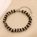 Dettaglio del bracciale intrecciato in acciaio inossidabile nero e argento con catenella - Acciaio e Nero (B-54)