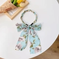 Light blue floral bow hairband with pearl and gold bead chain on white table - Light Blue Big Floral