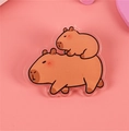 Cute capybara acrylic badge pin featuring stacked cartoon characters on pink background - No.9 Capybara