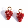 Close-up of red enamel strawberry pendants with gold accents for DIY jewelry - 3D Strawberry