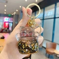 Creative Maneki Neko keychain with golden star sequins and a bell charm in hand - Lucky Cat Flash - Black / Individual Packaging