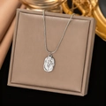 Silver tulip embossed pendant necklace with sleek snake chain displayed on jewelry box - Rose / Steel