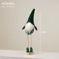 Green knitted Christmas gnome decoration with LED glowing nose and wood base - Large Standing Gnome With Light (Plaid)