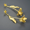 Elegant gold tulip S925 silver earrings with a matte texture on a dark grey background - Tulip Shape / Gold