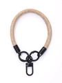 Close-up of woven nylon wrist lanyard with black metal rings and swivel clip connector - Magnolia Blue