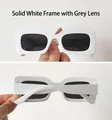 Detail view of rectangular white sunglasses frame with dark grey lenses and Y2K style - Solid White Frame Gray Lens
