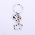 Cat keychain with white spotted feline charm and black paw print and bells - Bobtail Cat