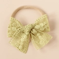 Detailed view of yellow embroidered lace bow on high-elastic nylon baby headband - Fruit Green