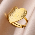 Adjustable golden heart ring with textured hammer finish on champagne silk background - Hammered Heart / Gold Heart Style