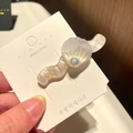Iridescent white seashell hair clip with pearl detail on branded display card - 12# Wavy Large Shell - White