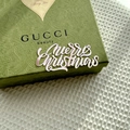 Detailed close-up of Gucci Beauty green embossed luxury gift box on white textured fabric - Silver / Extra Large / Plus Thick Style