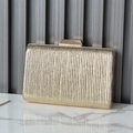 Elegant gold evening clutch bag with vertical pleated texture and metal clasp closure - Gold