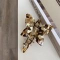 Detail shot of acetate butterfly hair claw clip with tortoise shell pattern and metal spring - Butterfly Claw / Milk Coffee Texture