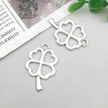 Detailed view of silver hollow clover pendants for DIY jewelry making accessories - Hollow Four-leaf Clover 24x17mm