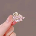 Pink crystal leaf hair claw clip with golden alloy finish held in hand for sizing - 3# Pink Leaf Mini Claw (Approx. 2.7CM)
