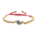 Gold-plated braided bracelet with blue enamel charm and sparkling zircon accents - Copper Beads Red Rope