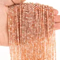 Dettaglio macro di perline tonde sfaccettate in pietra naturale arancio-rosa da 3mm per fai-da-te - 3mm / Pietra del sole