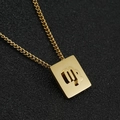 Golden stainless steel Virgo zodiac square pendant necklace on black textured background - Virgo