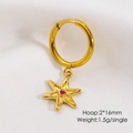 Macro detail of a 2x16mm gold hoop earring featuring a hex star pendant with red gemstone - Rhinestone Star