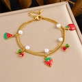 Close-up of double-layer gold bracelet with colorful fruit charms and pearls - Mixed Fruit Style (B1707)