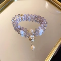Detail of layered bracelet with purple opal, pearls, and planet charm on mirror - Pink Cat's Eye Stone Crystal Double-layer Bracelet
