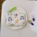 Close-up of quilted floral coin purse featuring cartoon girl print and neon green strap - Cute Girl